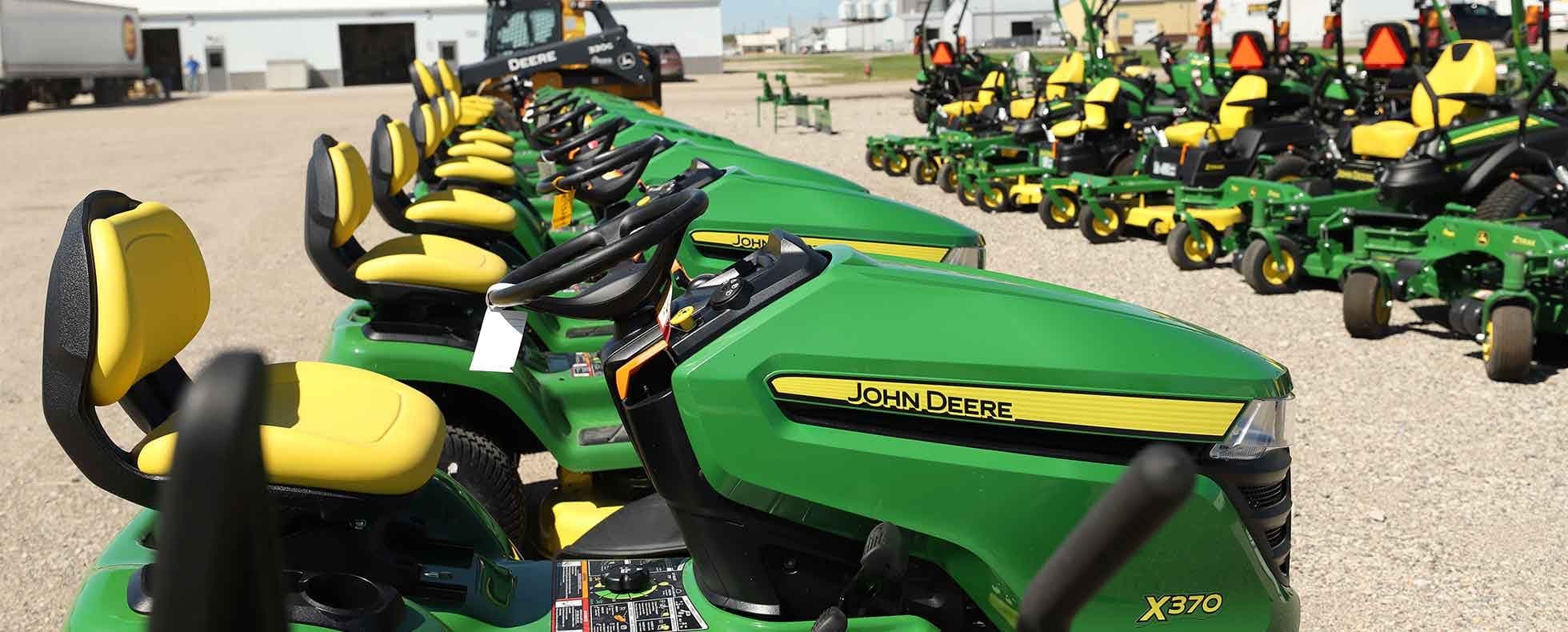 Equipment lined up across the dealership yard